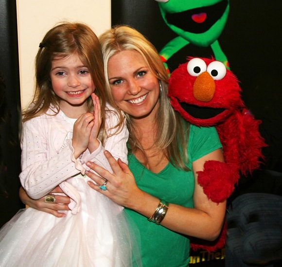 children0022.jpg - Terri and daughter Julia with Elmo at the opening night of ImaginOcean on March 31, 2010 at New World Stages, New York City, New York (Photo by Sue Coflin)